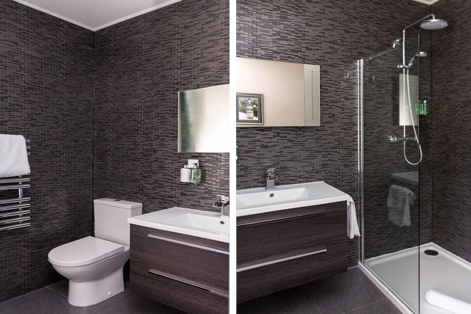 Ensuite bathroom featuring a sleek shower, modern fixtures, and stylish dark tile walls at The Dowan.