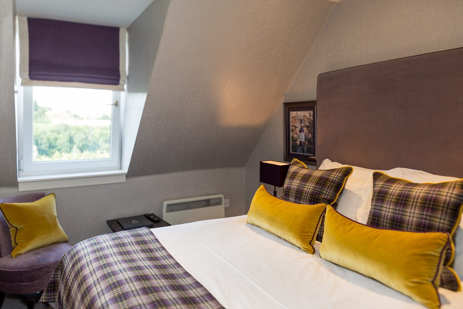 Comfortable hotel room with stylish decor and Scottish tartan accents in Moray, Speyside.