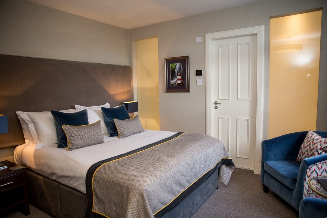 Comfortable hotel room at The Dowans Hotel in Moray with elegant decor.