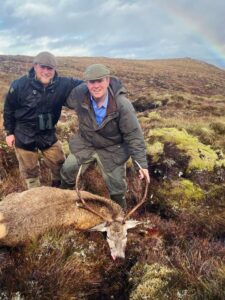 1. Men hunting red deer on Erchless Castle Estate, Scotland, in outdoor hunting adventure.