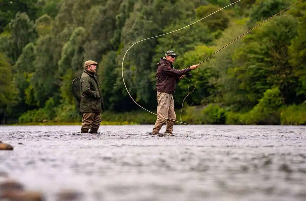 Riverside fishing at Erchless Castle Estate, Highland Scotland, perfect for outdoor fishing adventures.