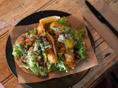Delicious tacos with fresh greens served at Frederic's Restaurant & Bar.