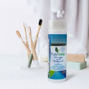 FulviHelp shampoo and body wash bottle with toothbrushes and soap bars.