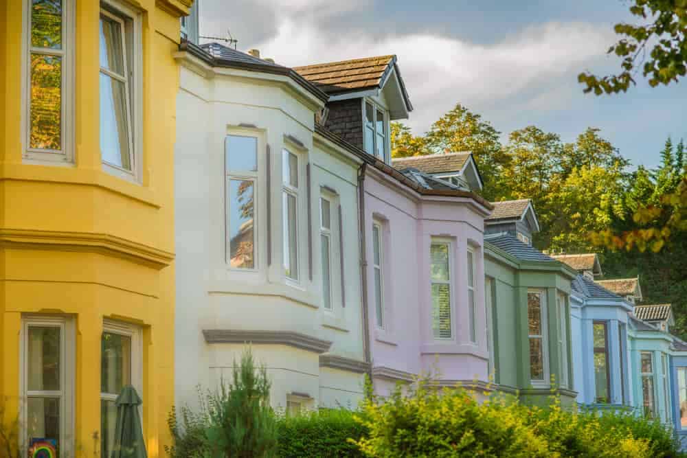 House facades in pastel colours, representing residential properties.