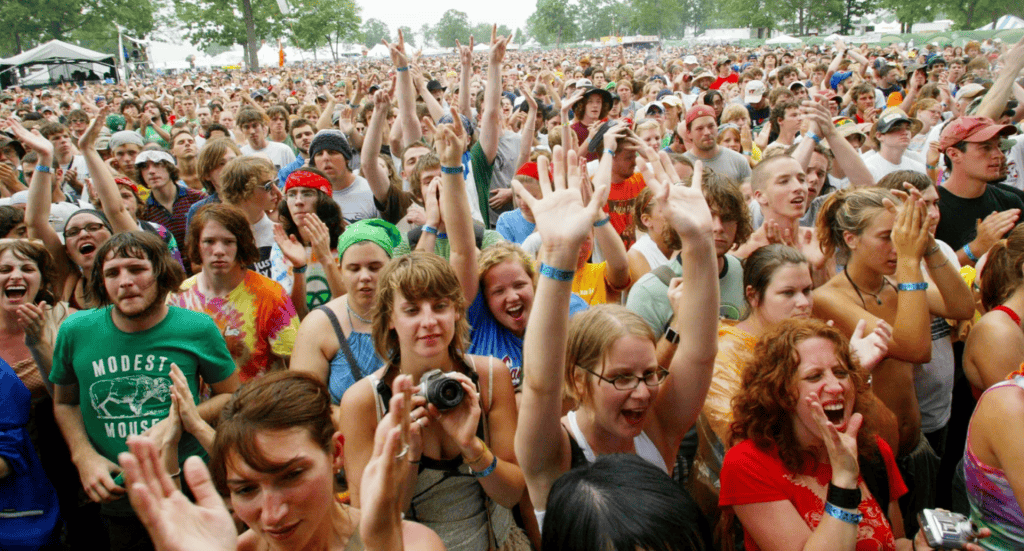 Crowd of festival-goers enjoying outdoor music event in Nashville TN.