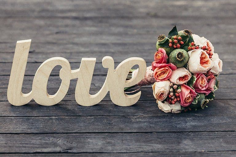 Romantic love word and bouquet for wedding decor.