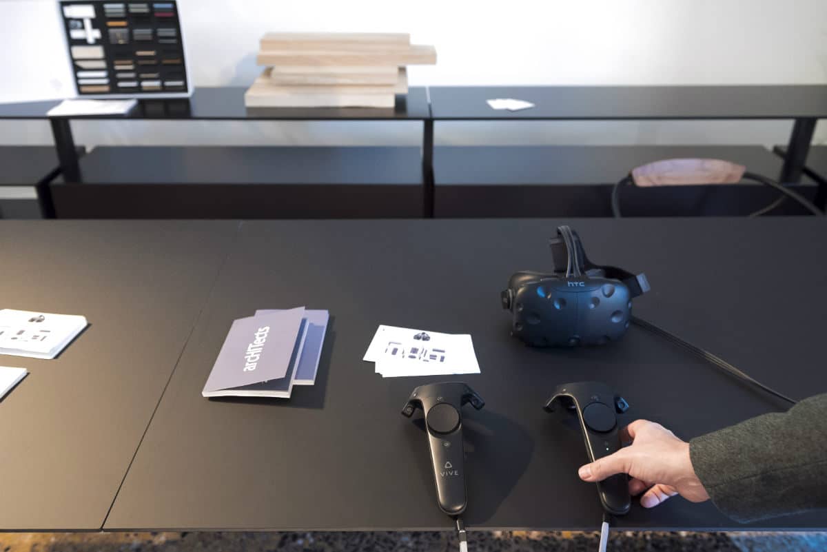 Virtual Reality Headset And Controllers On A Black Table At Salone Del Mobile 2017.