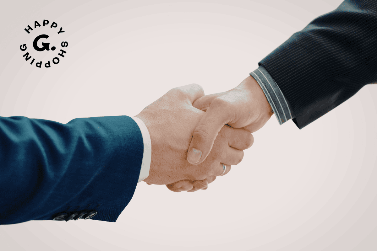 Two people in business attire shaking hands, symbolizing partnership, with a circular 'Happy Shopping' logo in the top-left corner.
