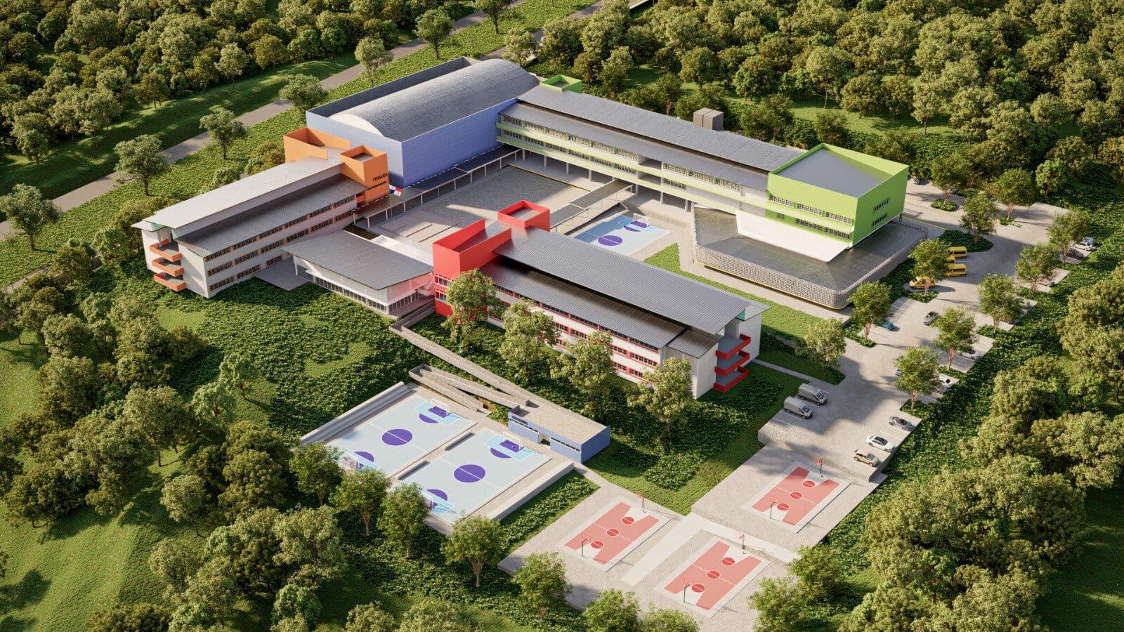Aerial view of a modern multi-building campus with colorful facades (orange, blue, red, green), surrounded by trees and outdoor courts/fields.