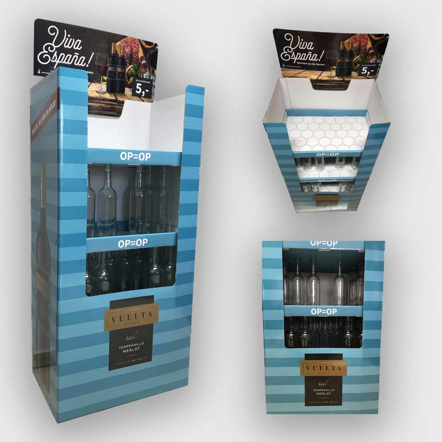 Blue striped wine display boxes with 'OP=OP' shelves and bottles visible through a window, branded 'Vuelta' wine. Promotional signage reads 'Viva España!' at the top.