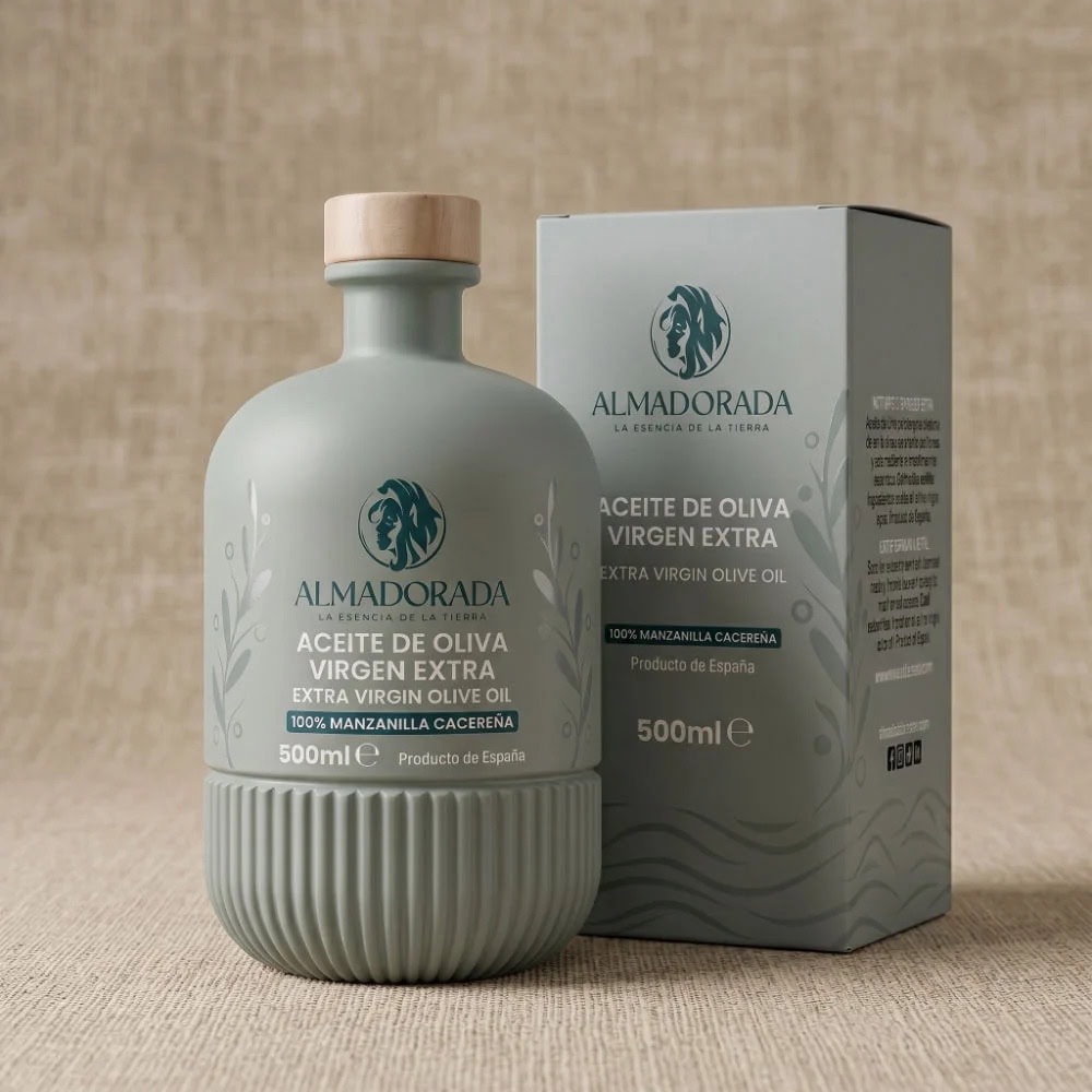 Gray-green Almadorada extra virgin olive oil bottle with wooden cap beside its matching box on a beige background, 500 ml label visible