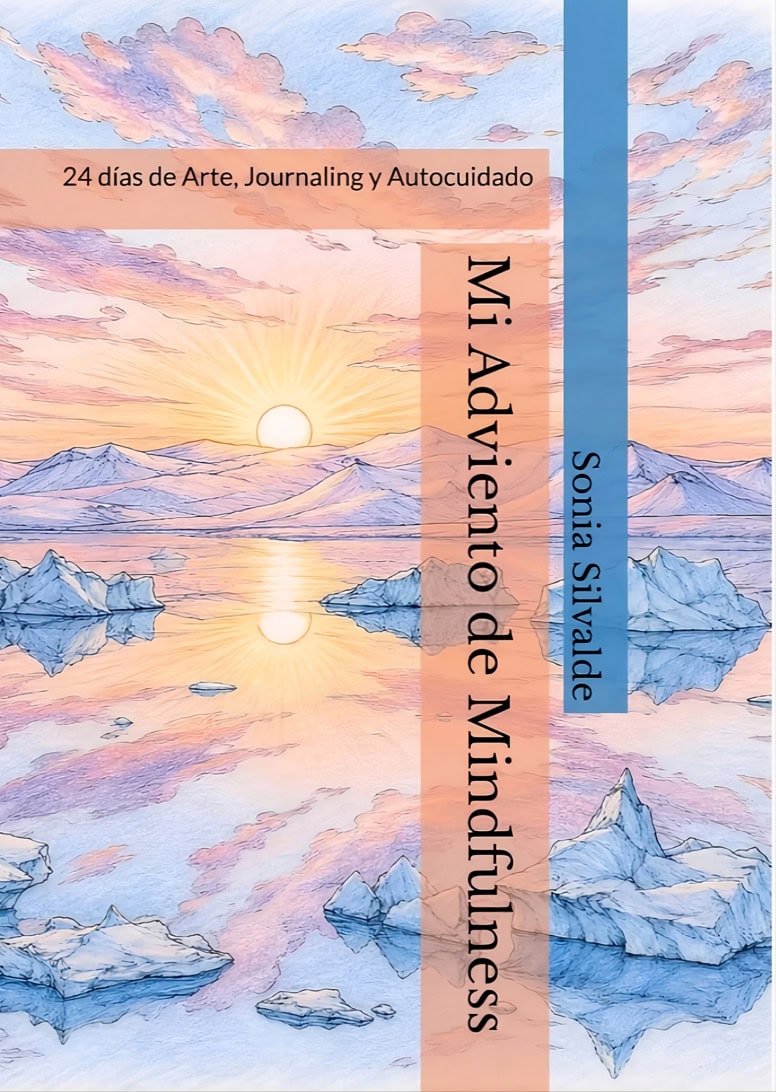 Book cover for Mi Adviento de Mindfulness by Sonia Silvade, featuring a pastel sunrise over icy mountains with peach and blue ribbons and the subtitle '24 días de Arte, Journaling y Autocuidado'.