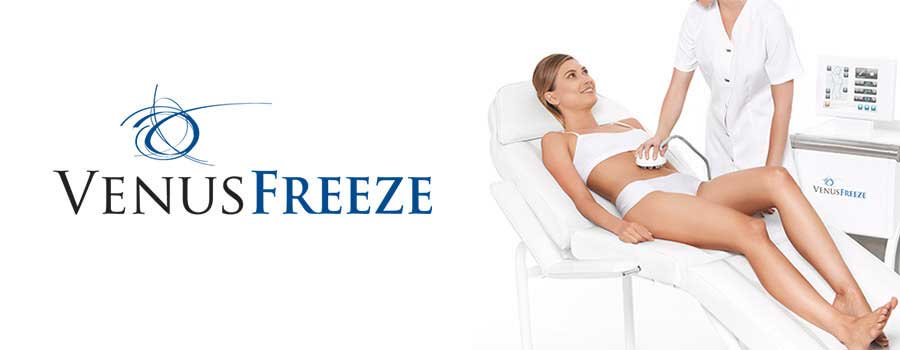 Woman receiving Venus Freeze abdominal treatment in clinic