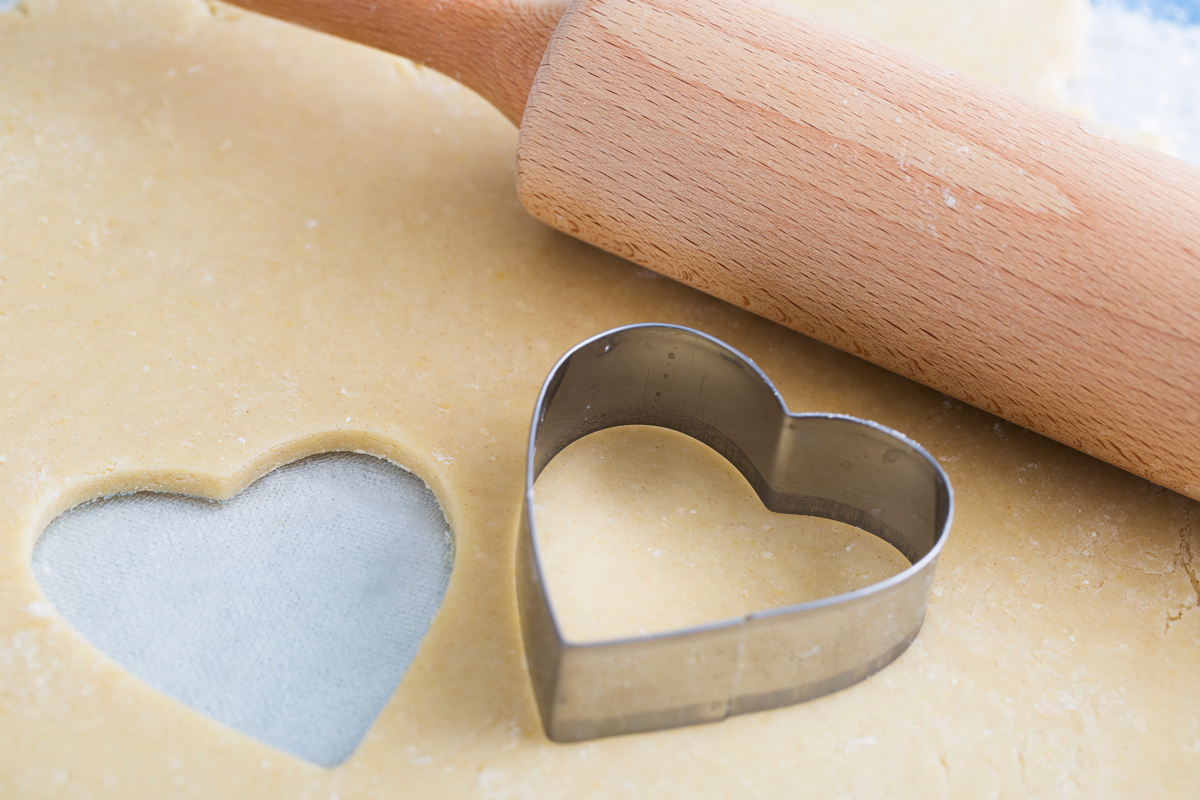 Choosing a social media platform. Picture of Heart Shaped Cookie Cutter and Dough.