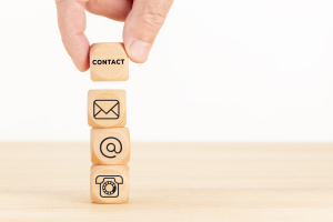 Wood blocks showing what needs to be on a websites contact page
