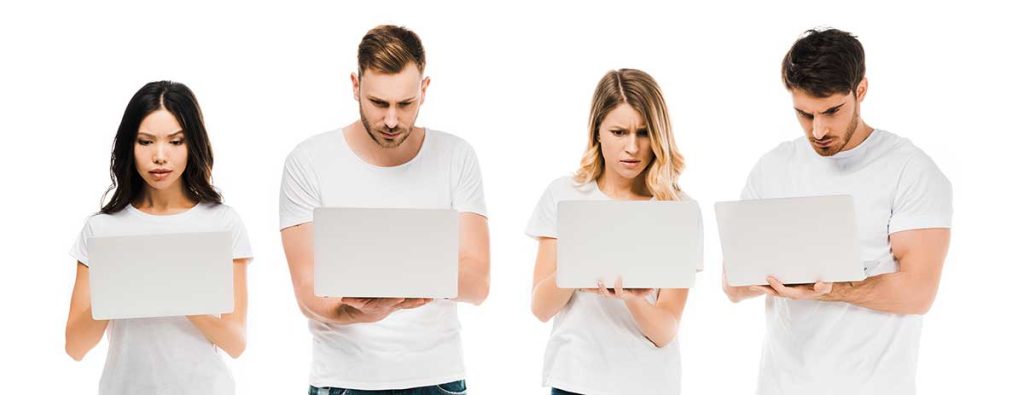 Focused Young People In White T Shirts Using Laptop