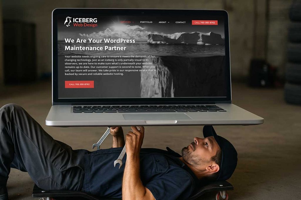 man laying on his back working on a website with mechanic's tools