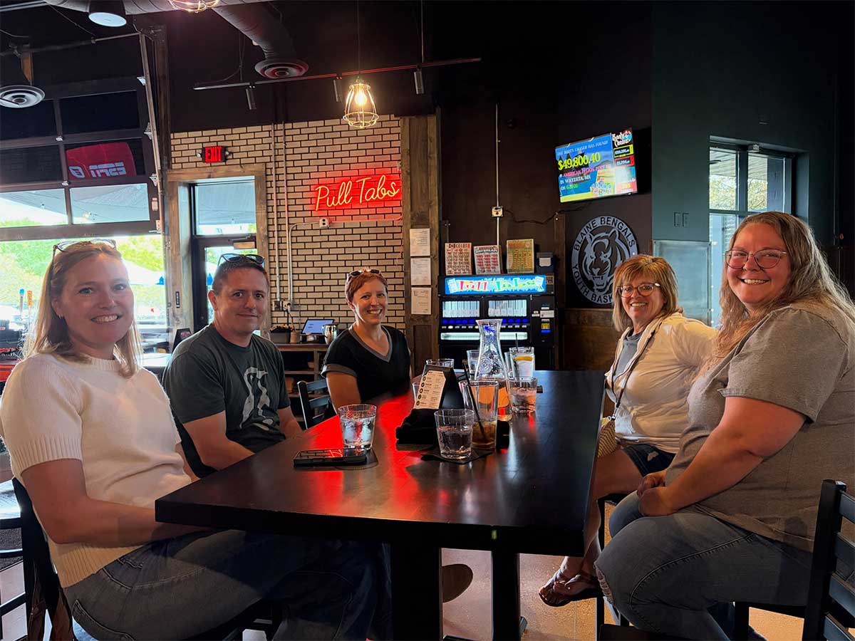 Iceberg Web Design team members enjoying lunch and drinks together