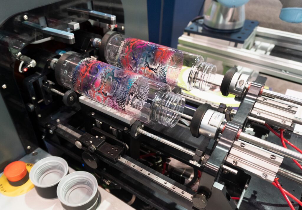 Custom printed bottles produced on an Inkcups cylindrical UV printer