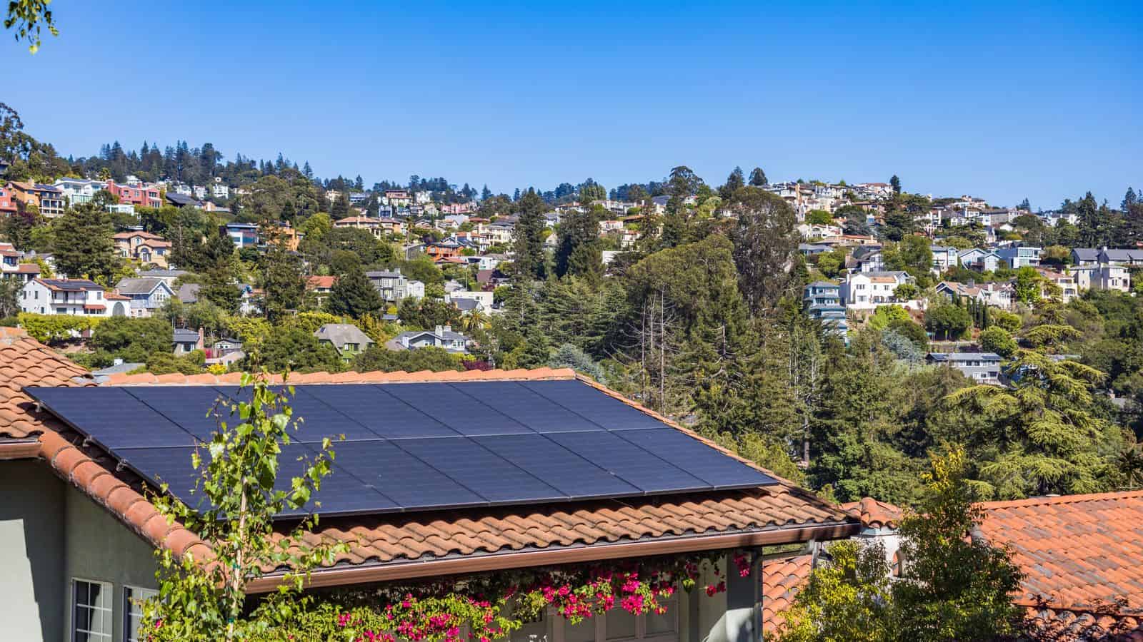 Solar panels mounted on the roof of a single-family Las Vegas home under a clear desert sky