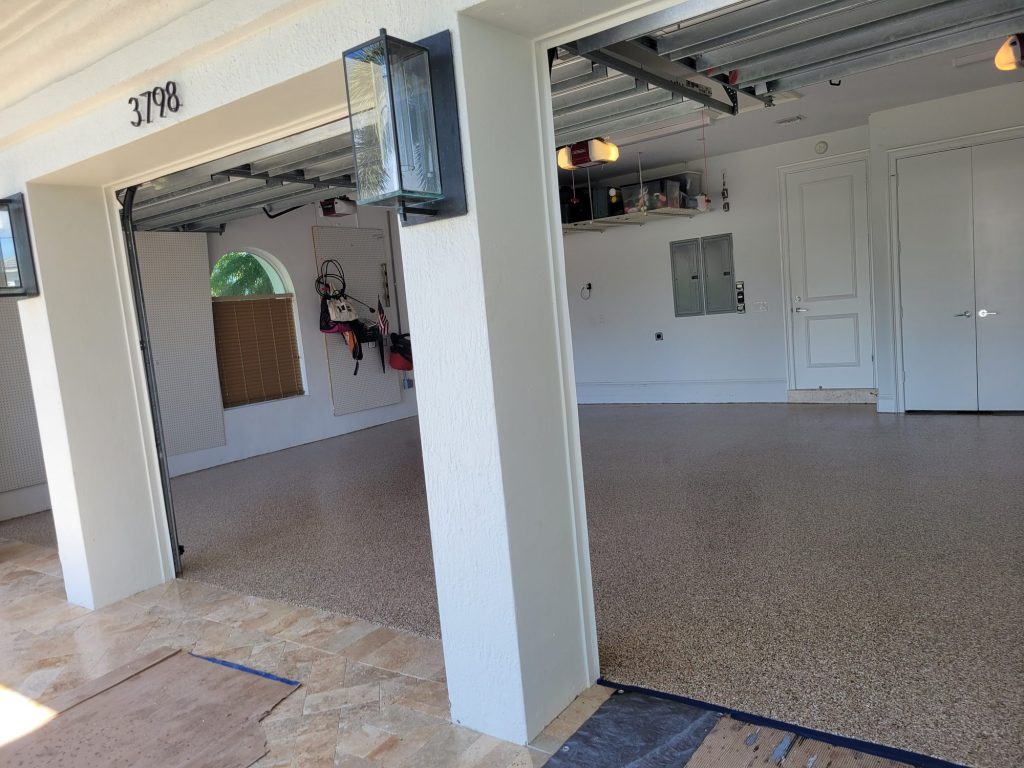 Garage floor coating: gray flake garage floor white columns