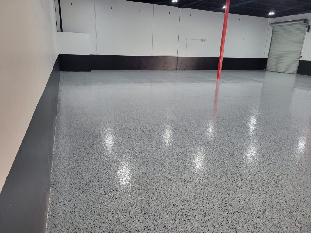 Commercial epoxy flooring: gray flake warehouse floor black base