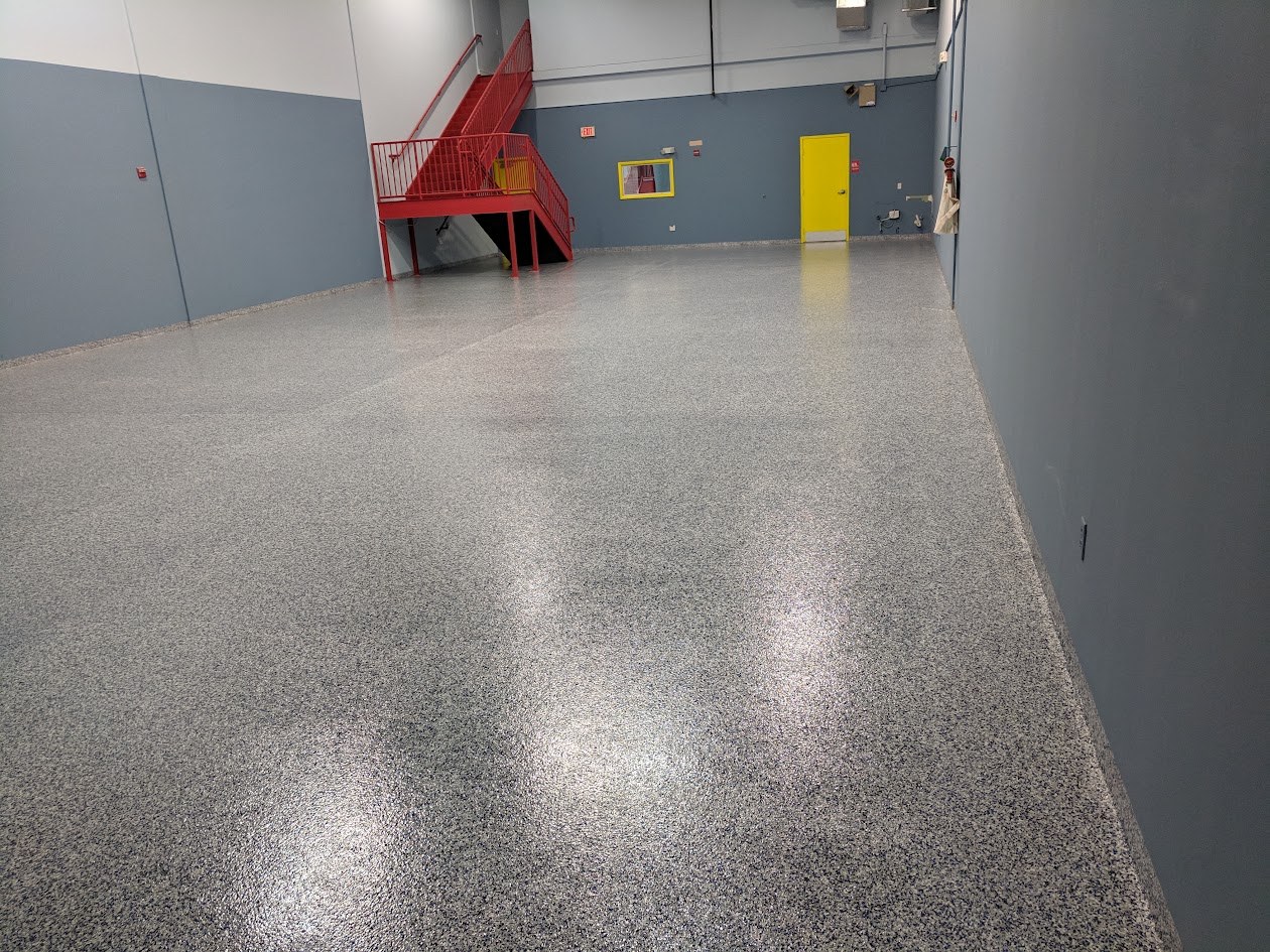 Finished gray flake epoxy warehouse floor