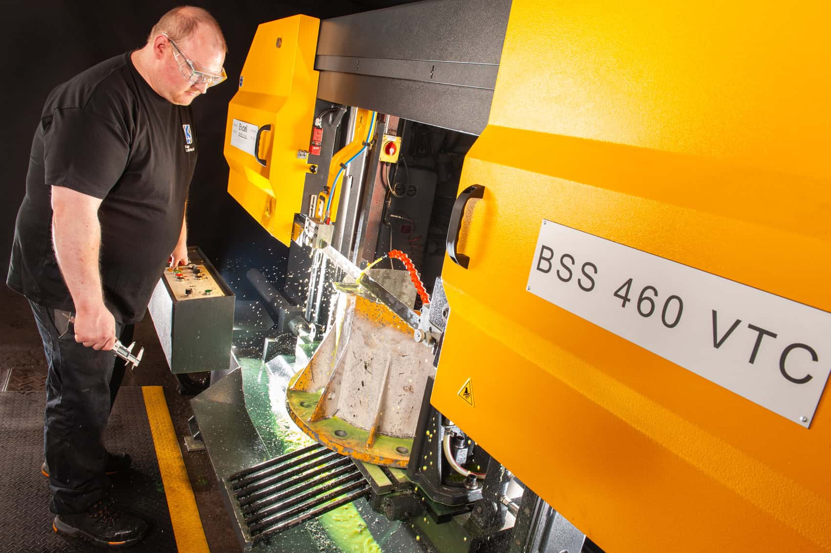 Technician operating advanced CNC machine at Keighley Laboratories.