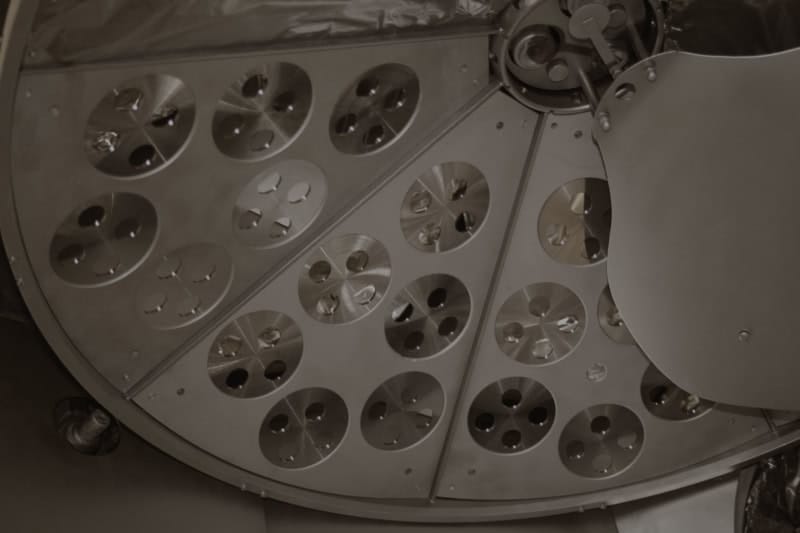 Custom Optics Manufacturer UK 10 Optics loaded into vacuum coating chamber tooling
