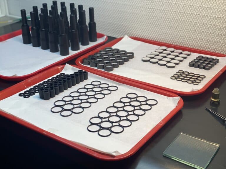 Optical assembly components prepared for cleanroom assembly