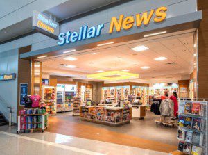 Stellar News store entrance with magazines and newspapers on display.