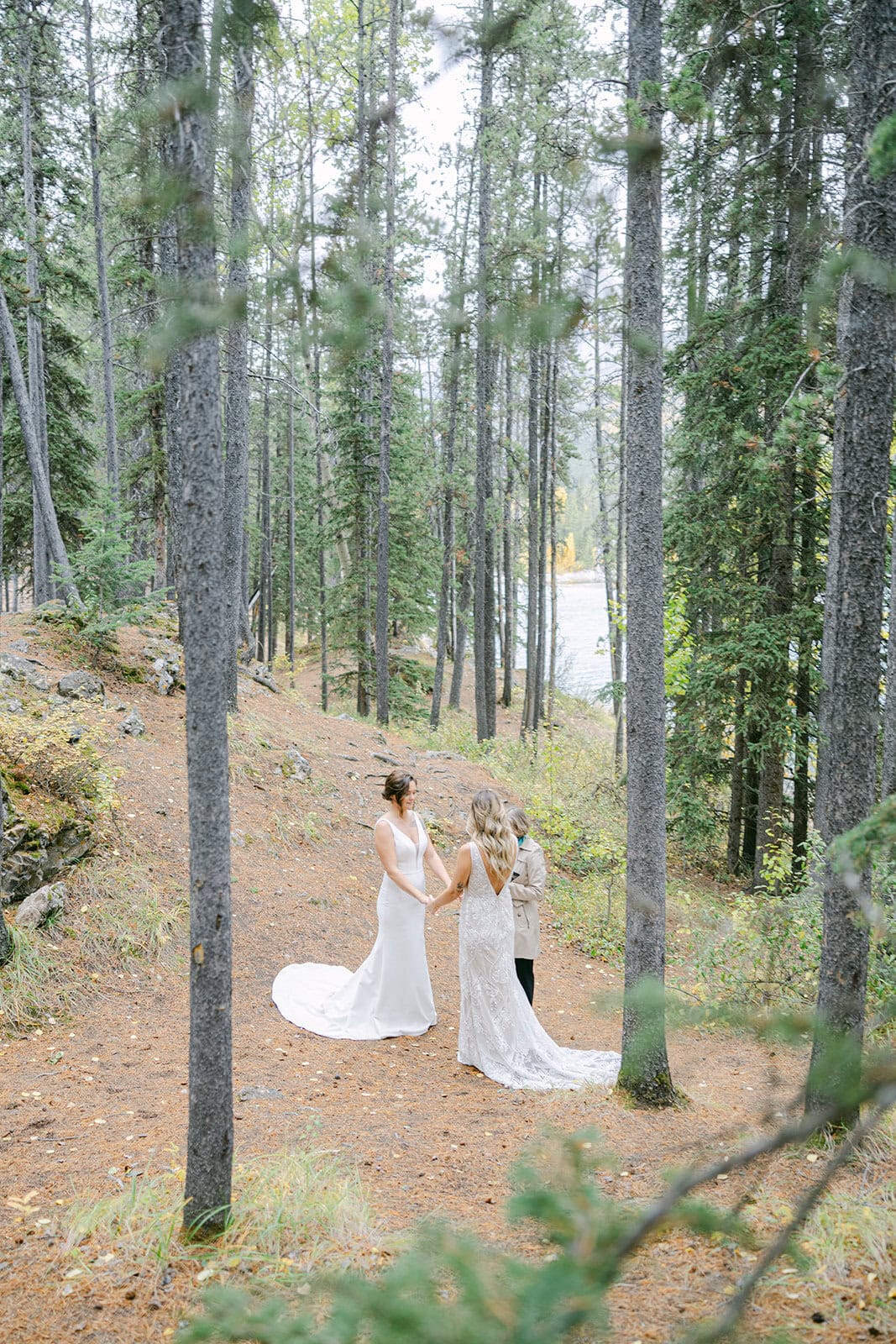 Banff elopement photographer documenting an intimate mountain ceremony at sunrise
