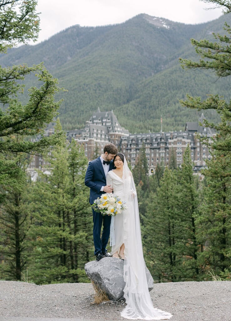 Fairmont Banff Springs wedding portraits featuring timeless architecture and alpine scenery
