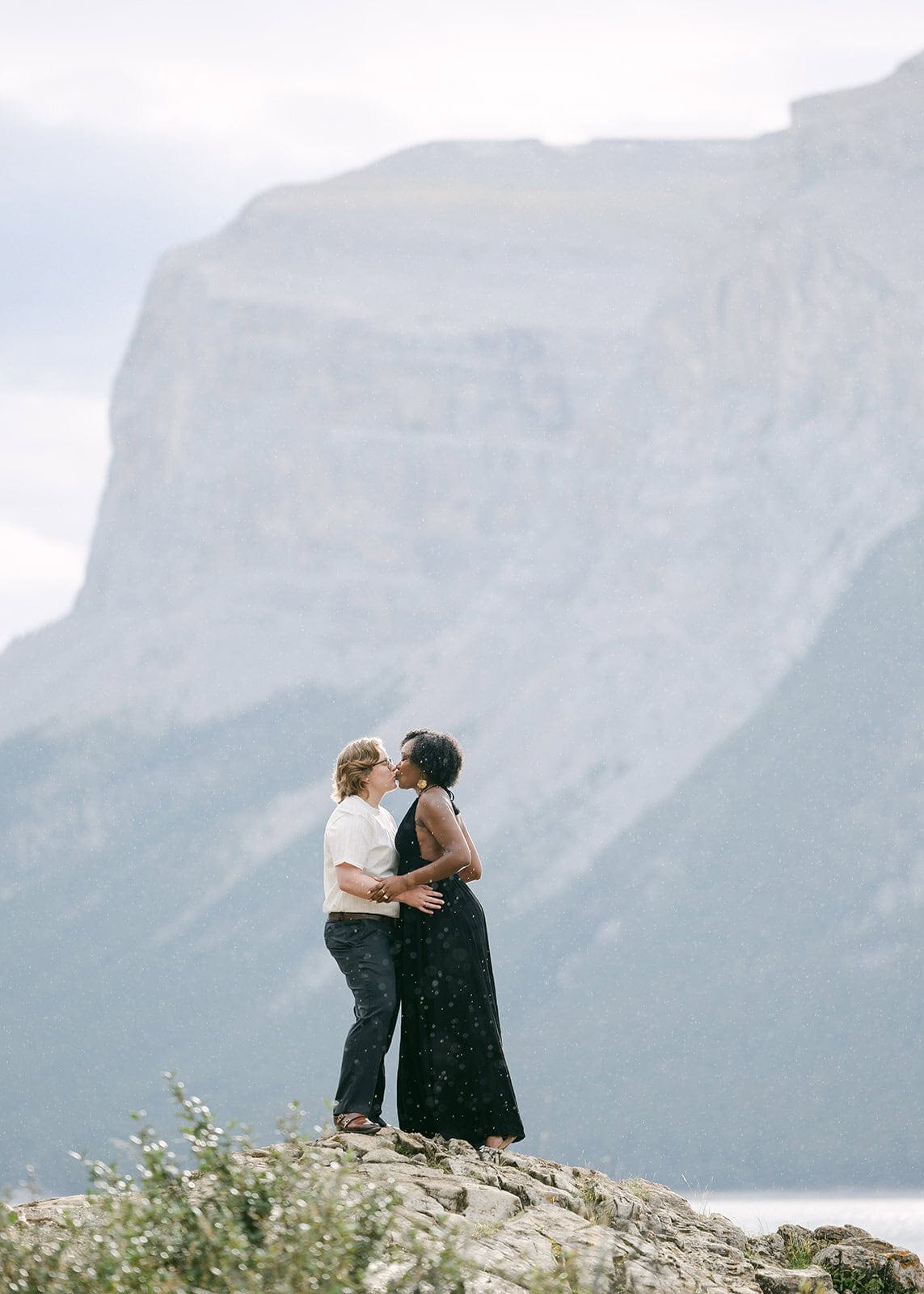Banff engagement photographer capturing candid moments on a scenic alpine trail