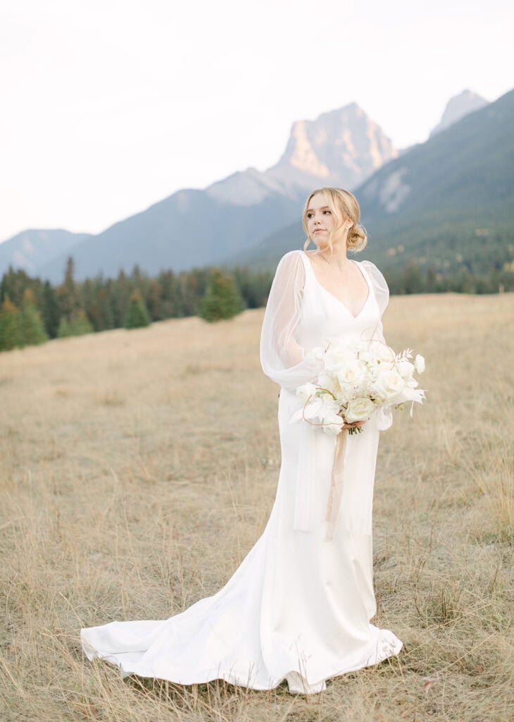 Canmore elopement with couple surrounded by dramatic mountain views