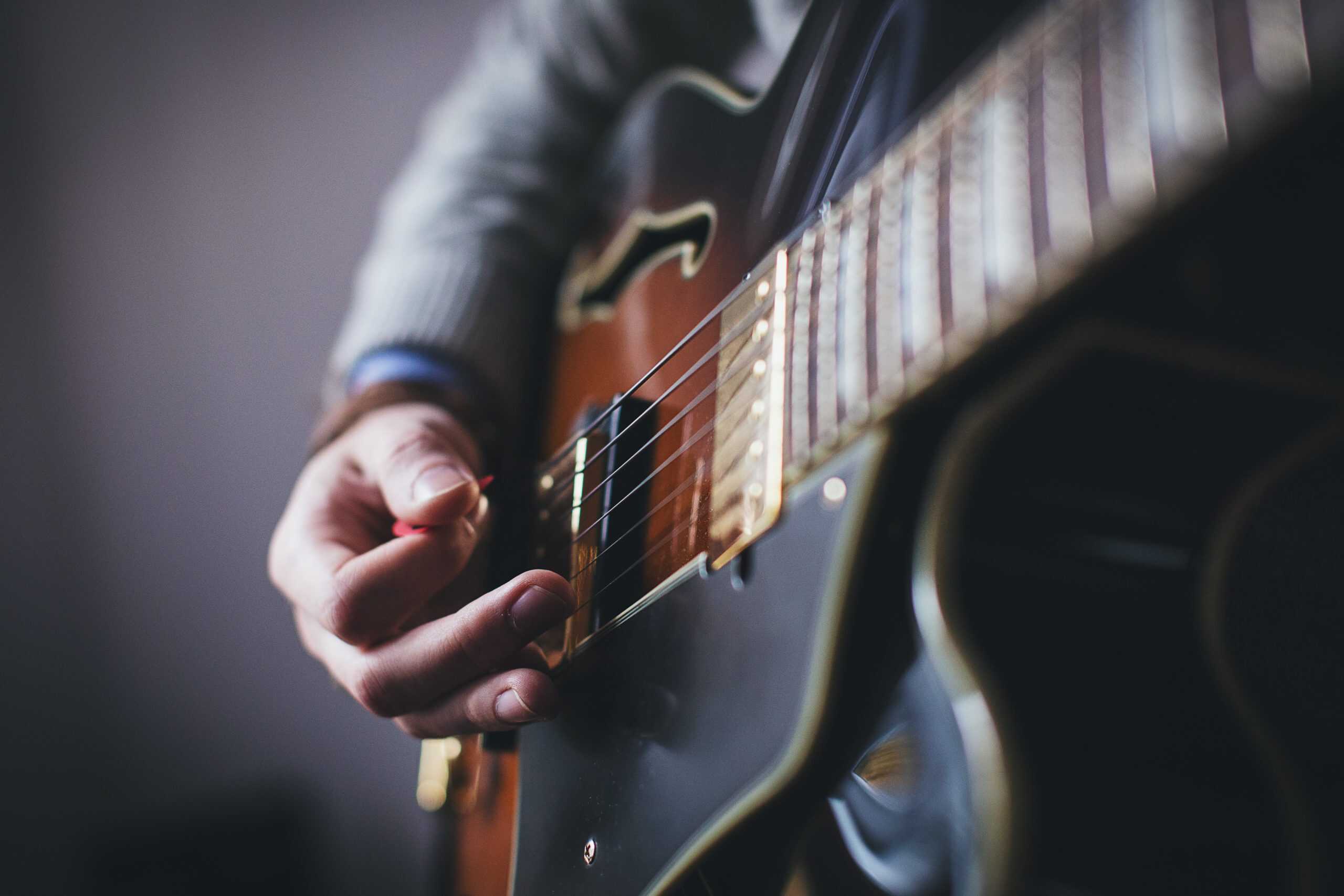man playing electric guitar