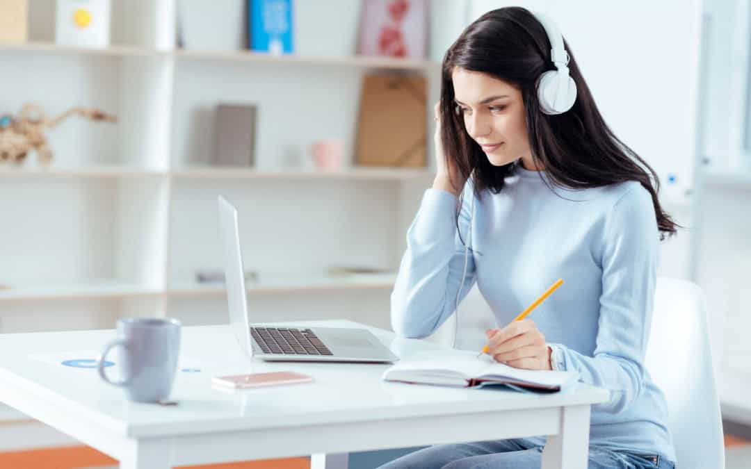 Pleasant female student listening to music