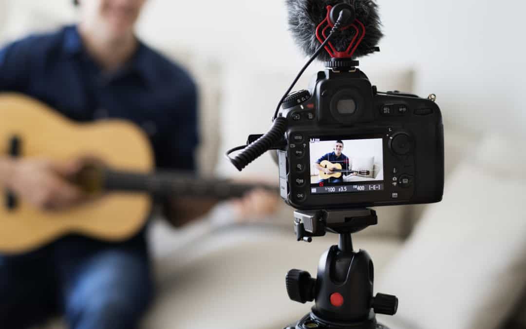 Male recording music related broadcast at home