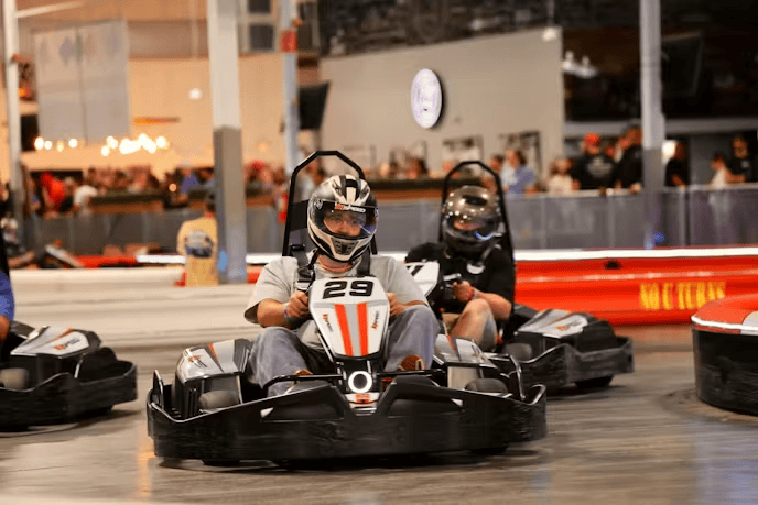 Kids racing go-karts at Mustang Week event in Charlotte.