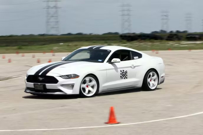 White Ford Mustang at Mustang Week Texas 2026 car event.