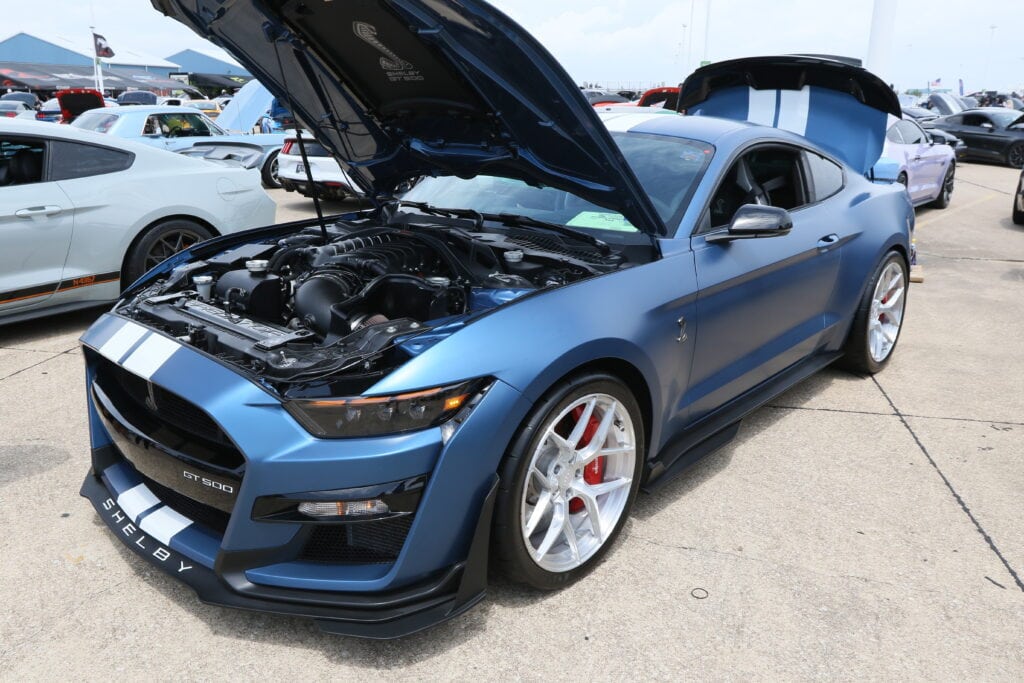 Mustang Week car with open hood at Texas event.
