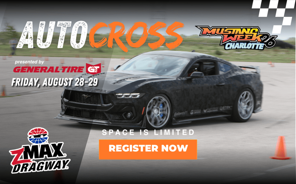 Black Ford Mustang racing at Mustang Week autocross event 2026.