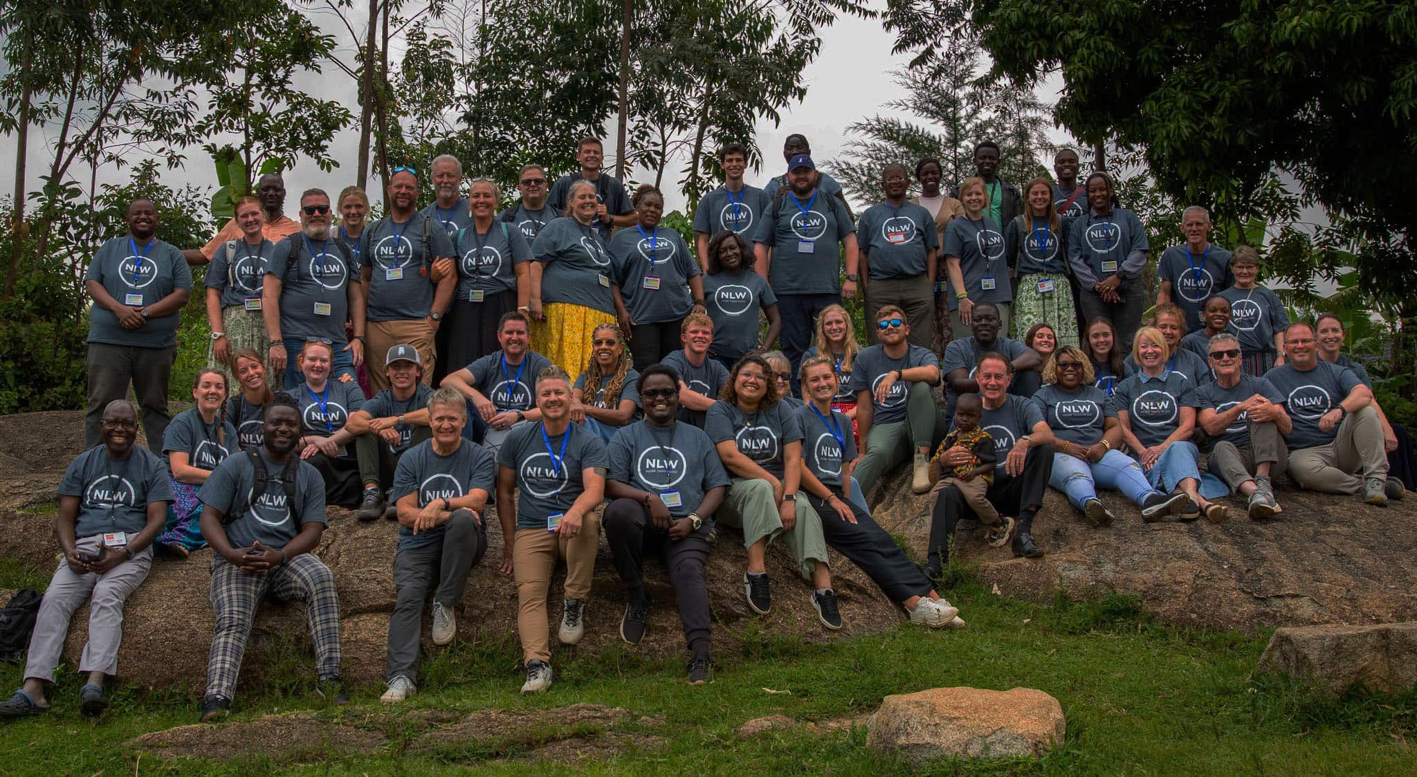 NLW International team group photo during outdoor event.