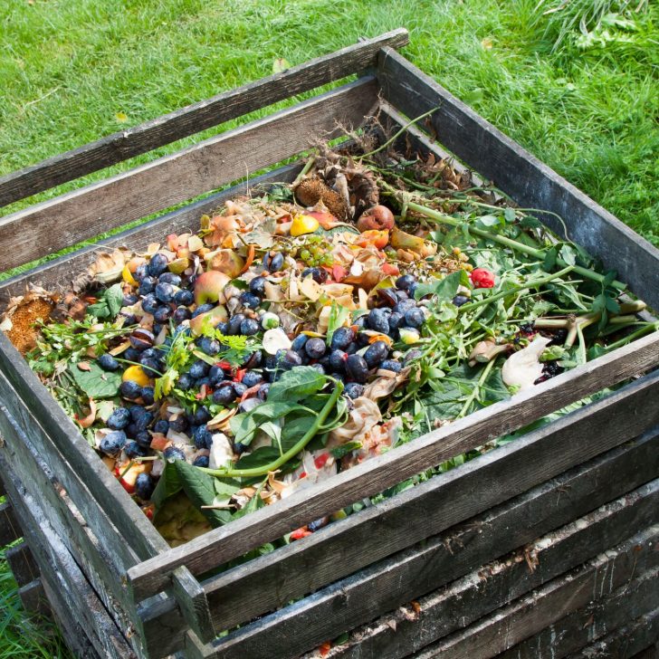 How to Compost: 6 Easy Steps to Create Your Own Compost Heap at Home | The Not so Modern Housewife wooden compost bin full of kitchen scraps - setting up your compost bin - how to compost