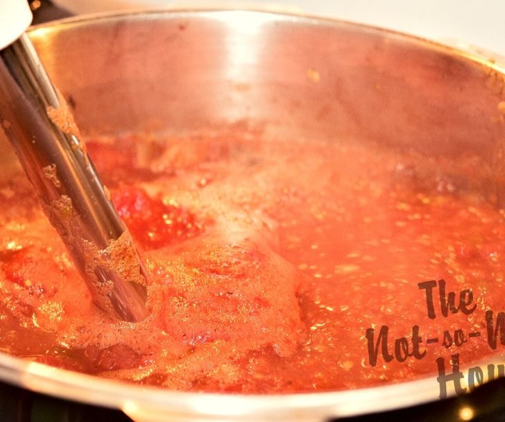 Delicious Restaurant Style Homemade Salsa Recipe with 4 Tips for Water Bath Canning | The Not so Modern Housewife immersion blender used to blend hot cooking salsa recipe
