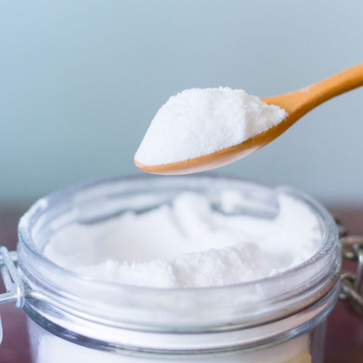 Why Moms Are Raving About This Homemade Laundry Powder Without Borax | The Not so Modern Housewife a spoonful of powder on a jar - homemade laundry powder without borax