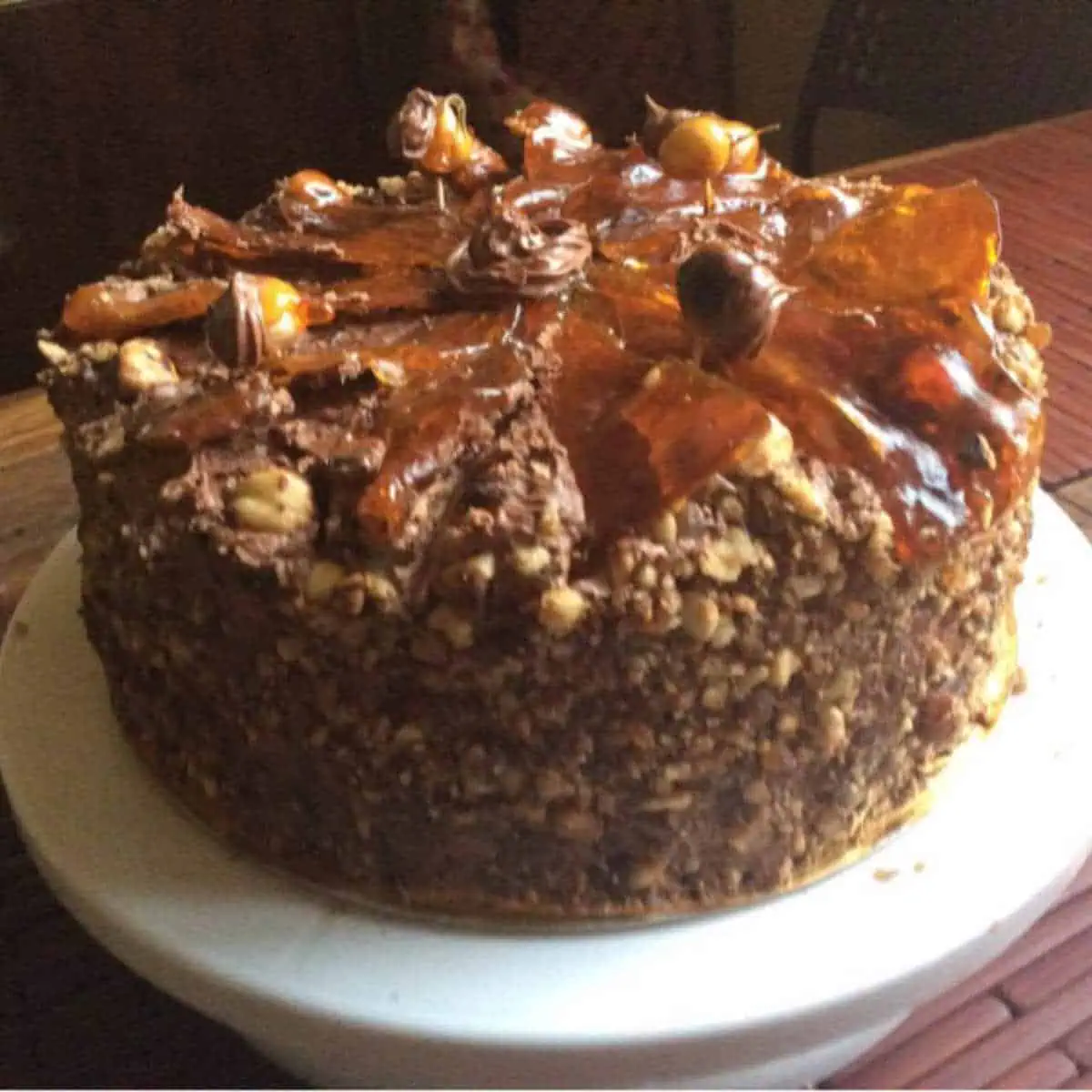 Dobos torte on a cake stand.