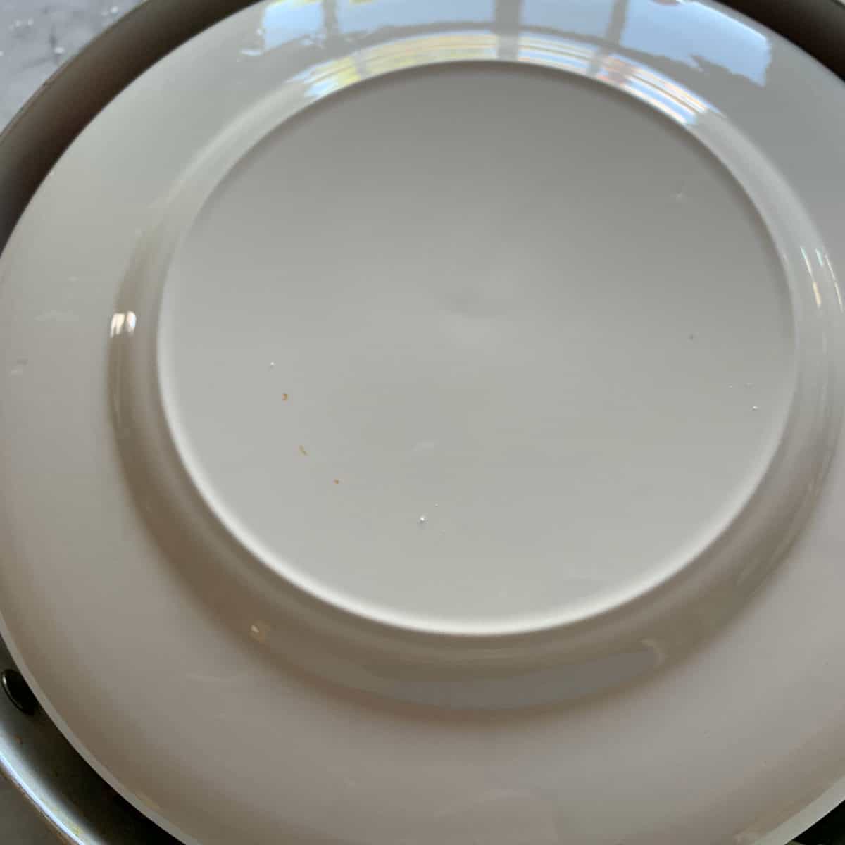 Flat plate placed upside down on the top.
