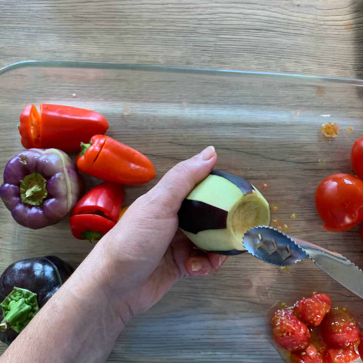 Carving eggplant with a corer.