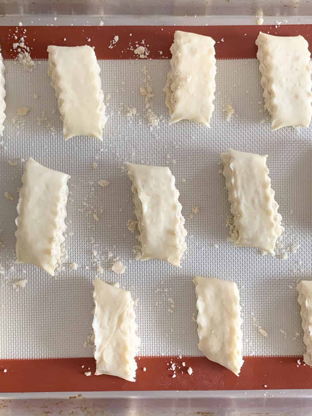 Arranging gata on a baking sheet.